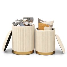 two white containers with gold trim and decorative items inside