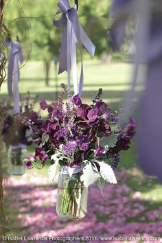 a vase filled with purple flowers on top of a table