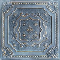 an ornate blue and gold tin ceiling tile