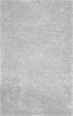 an area rug with grey and white colors