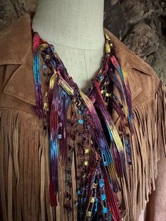 "Western scarf for women in south western colors. Brown, bronze, saffron red, cactus purple and turquoise teal ribbon with gold metallic sparkly yarn in same colors. Beautiful gradient coloring brings in mind Arizona scenery.  Great accessory idea for rodeos, western themed events or fun country night out. Goes well with jeans and just white T-shirt or with tan, brown and of course denim jacket or use it as a hat band on your cowboy hat.   This is traditional open scarf, about 70\" long. The length is give or take an inch or two because these are hand knitted and measuring can be a tricky since knitted material has a mind of its own.  Once your scarf arrives, please the scarf in half and give it a good stretch and then shake it a little bit to relax the fringes after its journey. You can d Handmade Multicolor Jewelry For Fall, Multicolor Fringed Scarves For Festivals, Multicolor Fringe Scarves For Festival, Festival Multicolor Scarves With Fringe, Hippie Multicolor Scarf One Size, Bohemian Scarves For Summer Parties, Bohemian Multicolor Scarves, Handmade Bohemian Jewelry For Fall, Multicolor Bohemian Scarves For Festivals