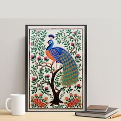 a peacock sitting on top of a tree next to a cup