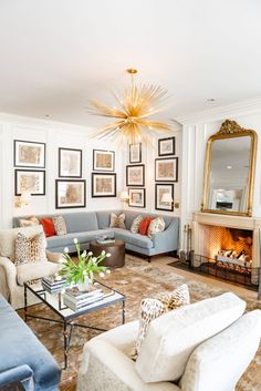 a living room filled with furniture and a fire place in the middle of it's walls