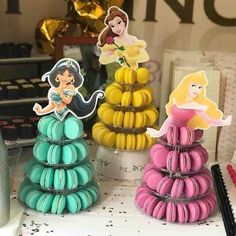 there are three princess macaroons on the table