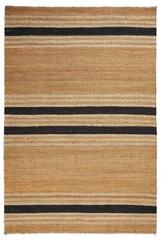 an area rug with black and tan stripes