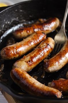 sausages cooking in a skillet with the words how to cook brats on the stove