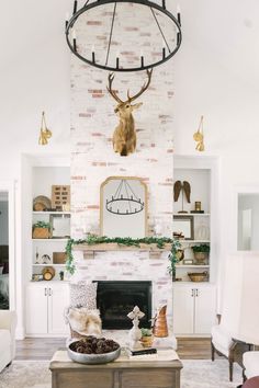 Limewash Fireplace - Deer Head over Mantle - Modern Farmhouse Living Room - German Smear - Wagon Wheel Chandelier - Living Room Built In's Farmhouse Patterns, Texas Interior Design, Farmhouse Tour, Texas Farmhouse, Wide Plank Floors, Rockwall Texas, Best White Paint, Farmhouse Interior Design, Best Farmhouse