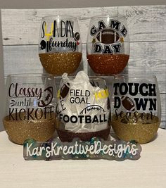 three wine glasses with football designs on them