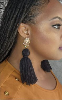 Elevate your style with our beautiful Black and Gold Yarn Tassel Earrings! Perfect for everyday wear or dressing up, these earrings are a nod to the New Orleans Saints - Who Dat! Bold and eye-catching, each earring weighs just 0.3 oz, making them lightweight and comfortable. Crafted with hypoallergenic pushbacks and hooks, they ensure a secure fit for sensitive ears. Make a statement with these stunning earrings! Tassel Drop Earrings For Evening, Party Plug Drop Earrings With Latkans, Party Drop Plug Earrings With Latkans, Party Drop Earrings With Latkans, Bohemian Long Drop Tassel Earrings For Party, Party Dangle Tassel Earrings With Latkans, Tassel Chandelier Drop Earrings For Parties, Tasseled Chandelier Drop Earrings For Party, Party Tassel Drop Earrings With Latkans