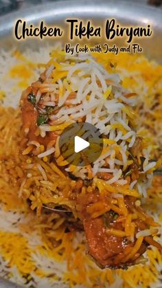 chicken tikka biriyani served with rice and pistats on a plate