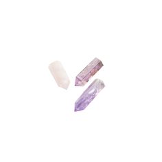 three ametholite points are shown against a white background, one is purple and the other is light pink