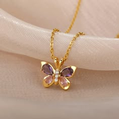 This cute butterfly necklace symbolizes beauty, love, and hope! Perfect gift for yourself or any of your loved ones. ✦ WHY YOU'LL LOVE IT: 🪙 Gold/platinum necklace ✨ Symbolizes powerful emotions/traits 🎁 Unique gift idea ✦ PRODUCT DETAILS: * Pendant Size: 2 Centimeters // 0.8 Inches * Chain Length: 45 Centimeters // 18 Inches * All our work is custom-made by hand with love 💖 ✦ FREE SHIPPING + 15% OFF (4-9 Days) --- Do you love this item and want to buy it later? Just click on the heart-shaped icon to your right to add it to your favorites. If you have any questions or special requests just send me a message and I will gladly help you. ✦ Thank you for shopping small and supporting my dream! Elegant Purple Butterfly Necklace Gift, Elegant Purple Butterfly Necklace For Gift, Elegant Gemstone Butterfly Necklace Gift, Butterfly Charm Necklace For Birthday, Butterfly Pendant Necklace For Mother's Day, Dainty Butterfly Necklace For Mother's Day Gift, Mother's Day Butterfly Pendant Necklace, Mother's Day Butterfly Charm Pendant Necklace, Pink Butterfly Necklace Gift