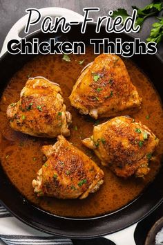 four chicken thighs in a pan with parsley on top and the title overlay reads, pork fried chicken thighs