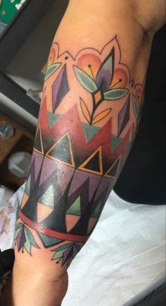 a person with a colorful tattoo on their arm