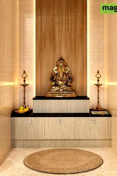 a golden buddha statue sitting on top of a wooden bench in a room with white walls