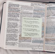 an open bible with writing on it