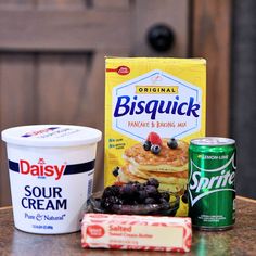 the ingredients to make pancakes are sitting on a table next to an ice cream and yogurt