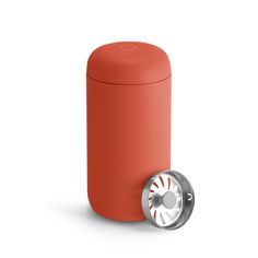 an orange and silver trash can with a metal lid on the side, next to it's cover