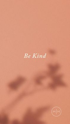 the words be kind are in white letters on a pink background with a shadow of a plant