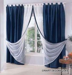 a living room with blue and white curtains