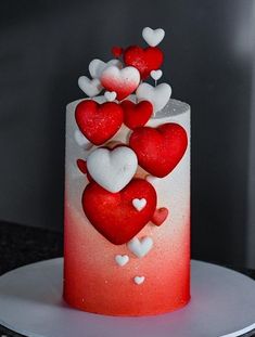 a red and white cake with hearts on it