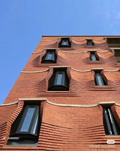 a tall brick building with many windows