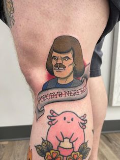 a man's leg with a cartoon character on it and an inscription that says nobody's nerfed