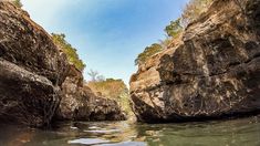 the water is clear and there are some rocks