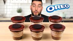 the man is making oreo cookies in his cupcakes and it looks like he's ready to eat them