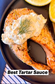 there is a plate with salmon and lemons on it, along with the words best tartar sauce