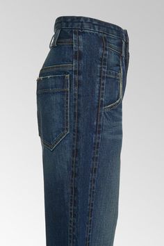 the back view of a woman's jeans skirt with pockets and buttons on the side