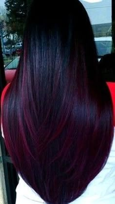 the back of a woman's head with dark red hair