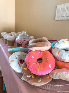 doughnuts and donuts are arranged on a table