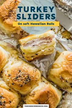 turkey sliders on foil with text overlay that reads, turkey sliders on soft hawaiian rolls