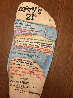 a piece of paper that has been made to look like a pair of shoes with the words mary's 21st written on it