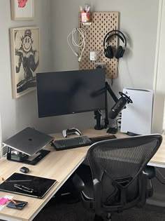 a computer desk with headphones on top of it