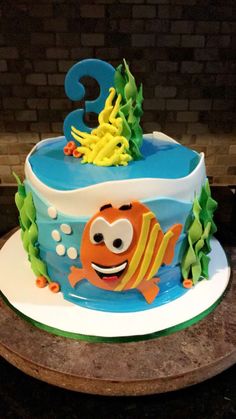 a birthday cake decorated to look like an ocean animal with the number 3 on it