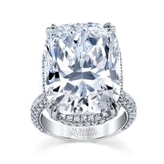 a cushion cut diamond ring with pave set shoulders