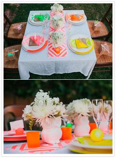 the table is set with colorful plates and flowers