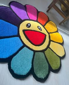 a colorful rug with a smiley face on it