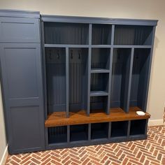 a room with some shelves and benches in it