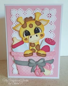 a card with a giraffe sitting in a basket