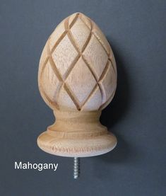 a close up of a wooden object on a gray background with the words mahoganyny written below it