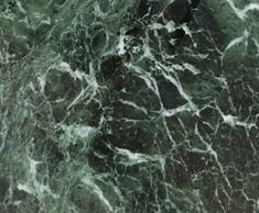 green marble with white swirls on it