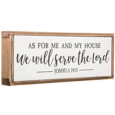 a wooden sign that says as for me and my house we will serve the lord