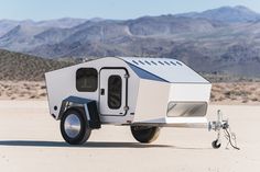 an off - road camper is parked in the desert