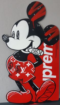 a mickey mouse sign with the word disney on it's face and an image of a basketball player