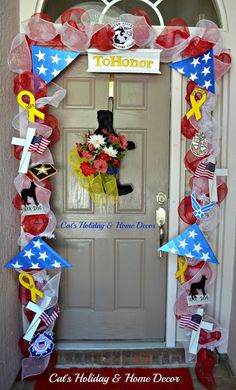 the front door to a house decorated with patriotic decorations