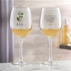 two wine glasses sitting next to each other on a table