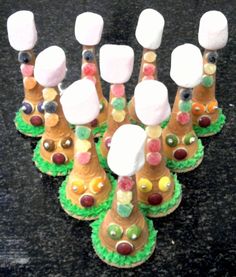 there are many candy trees made to look like animals with marshmallows on them